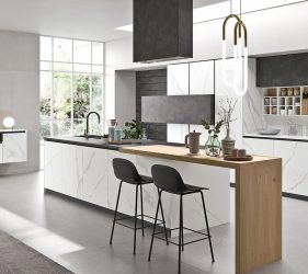 cucina moderna e luminosa bianca e nera in marmo bianco con dettagli e arredi neri. ambiente minimal ma sofisticato